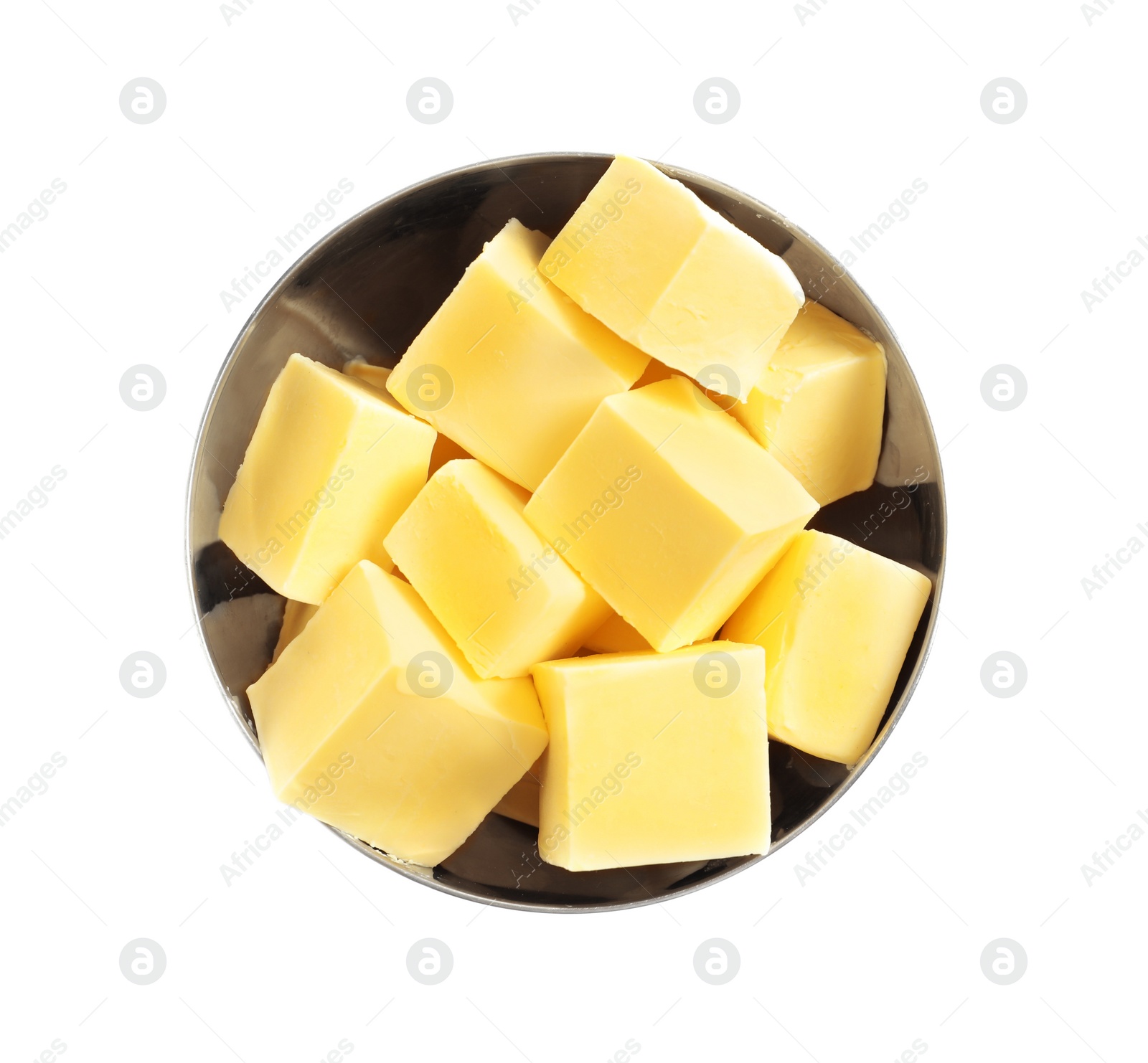 Photo of Bowl with cubes of fresh butter on white background, top view