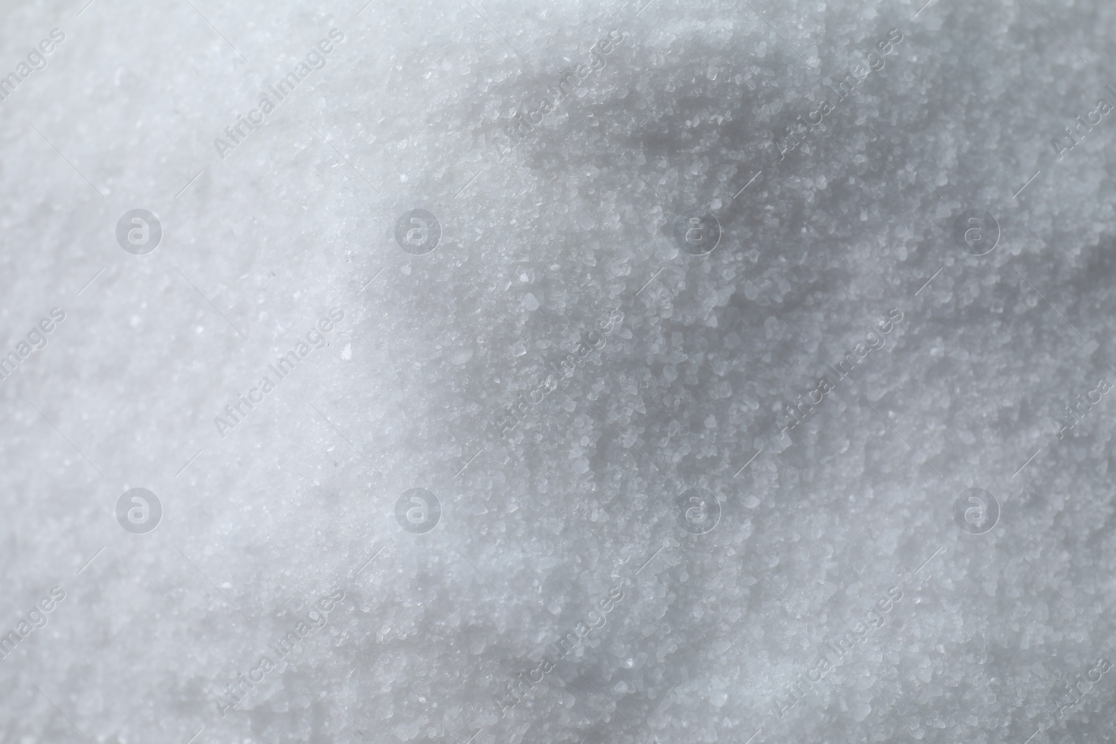 Photo of Organic white sea salt as background, above view