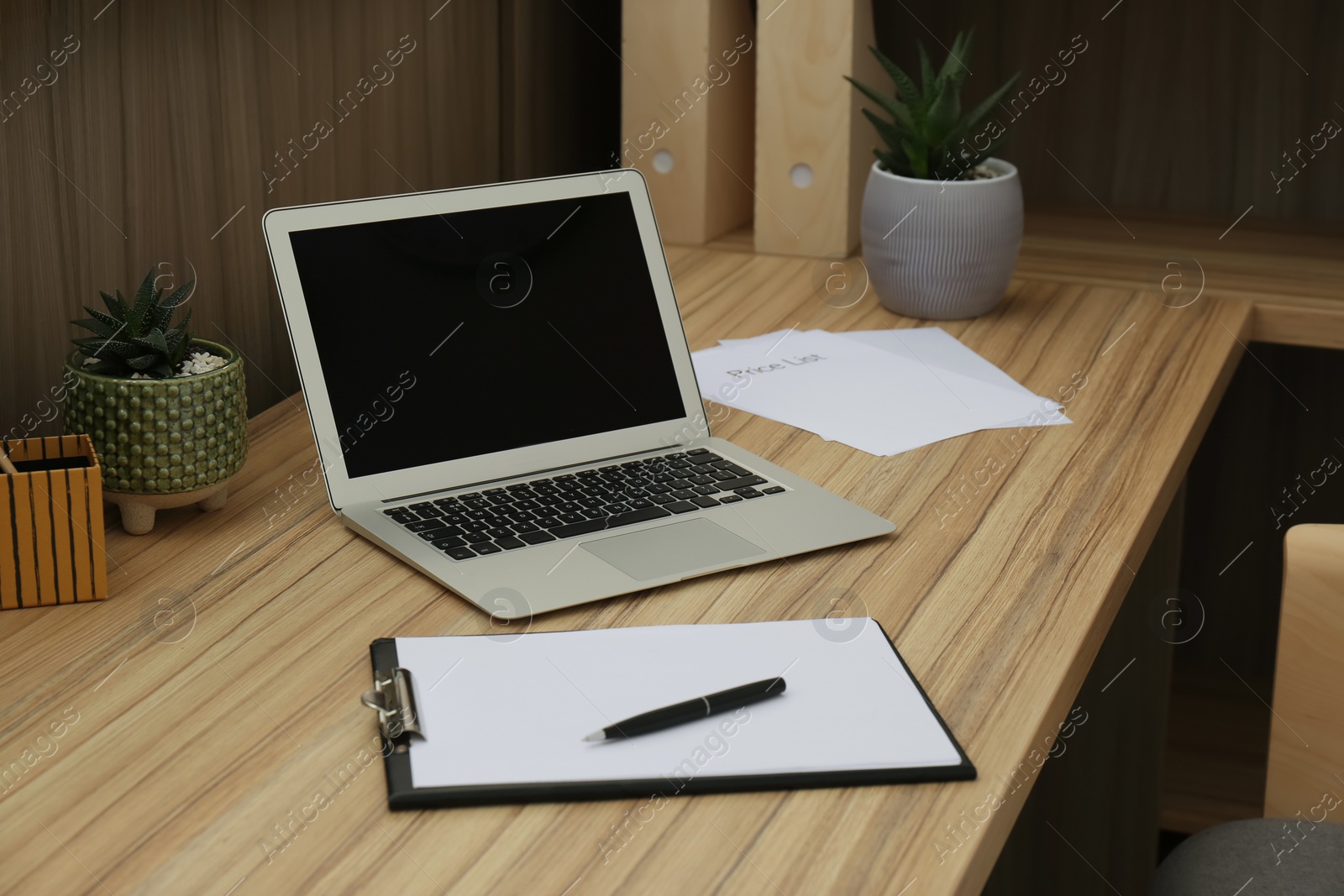 Photo of Receptionist's workplace with laptop in hotel. Interior design