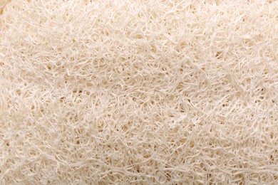 Photo of Loofah sponge as background, top view. Personal hygiene product