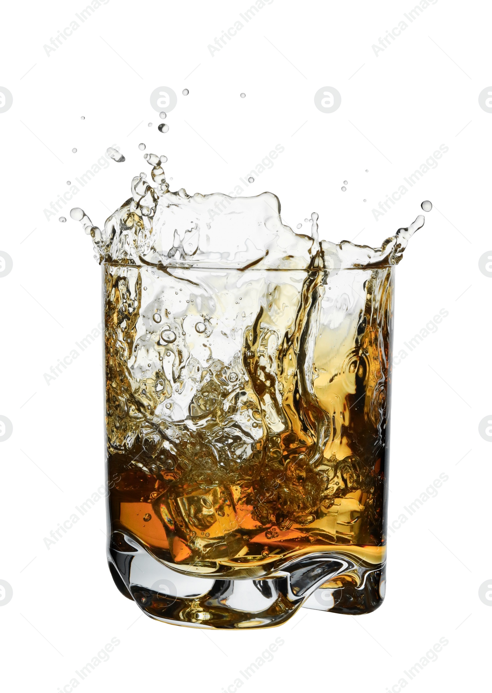 Photo of Whiskey splashing out of glass on white background