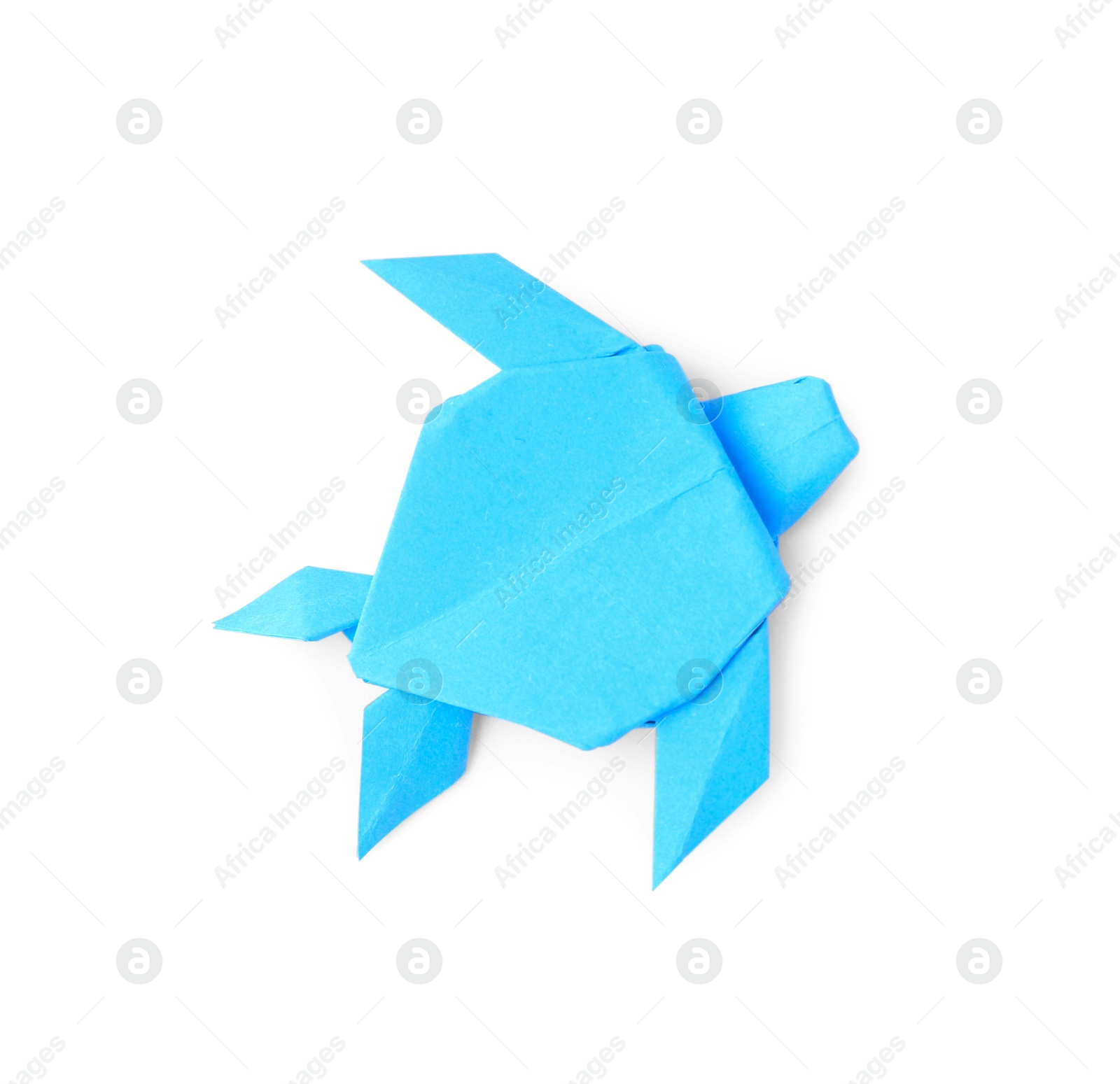 Photo of Origami art. Handmade light blue paper turtle on white background, top view