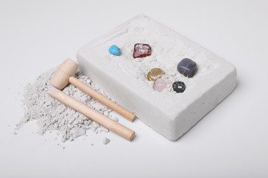 Photo of Excavation kit on white background. Educational toy for motor skills