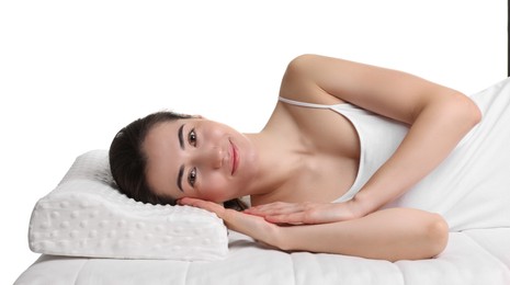 Photo of Woman lying on orthopedic pillow against white background