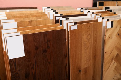 Photo of Many different samples of wooden flooring in store