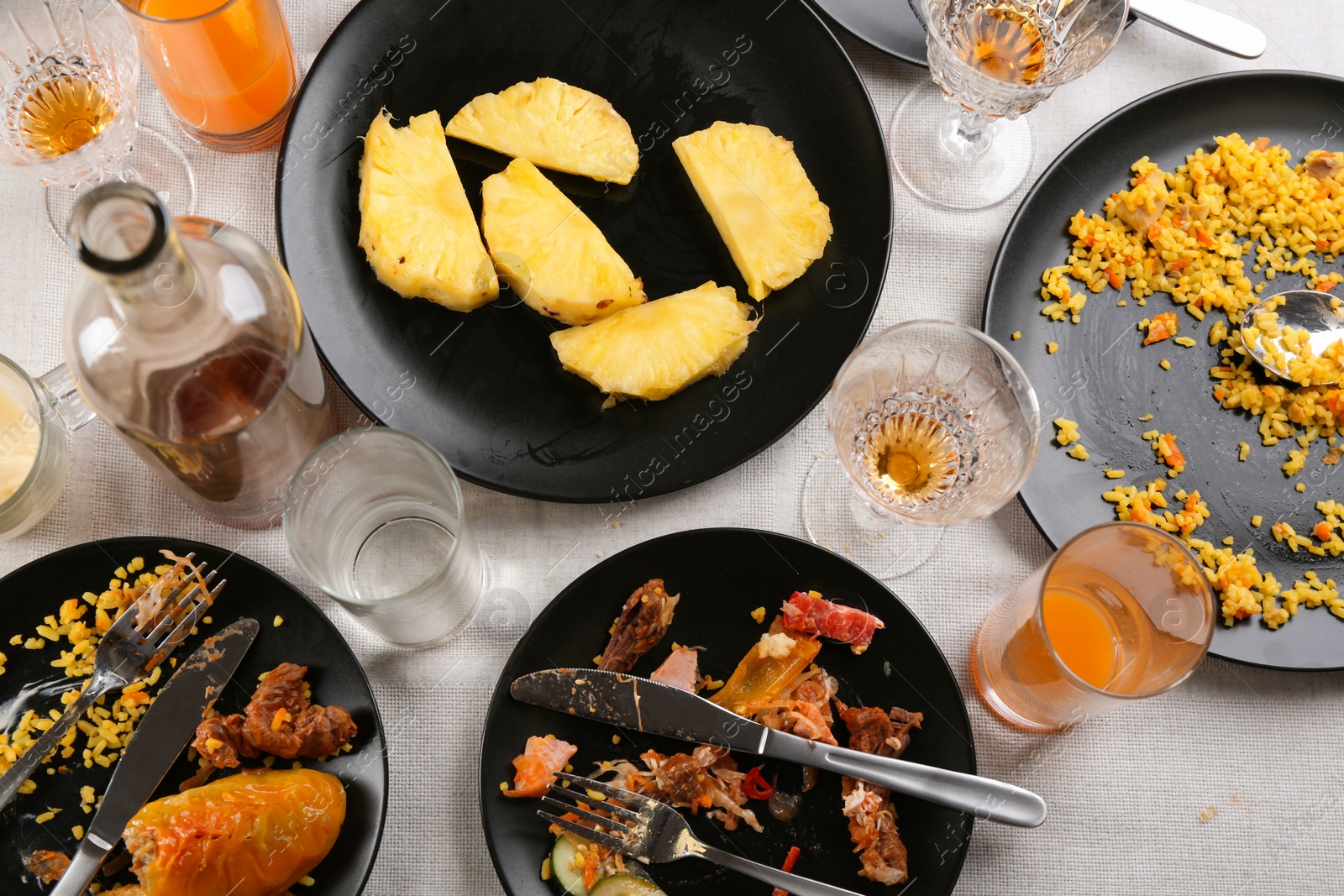 Photo of Composition with food leftovers after party on table, above view