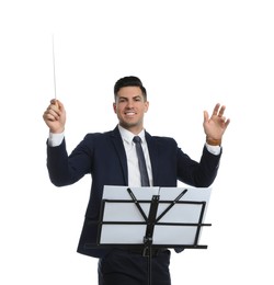 Music teacher with baton and note stand on white background