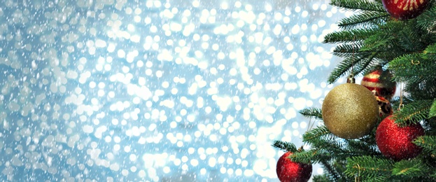 Image of Greeting card design. Beautiful decorated Christmas tree against blurred fairy lights, space for text
