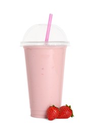 Photo of Plastic cup of tasty smoothie and fresh strawberries isolated on white