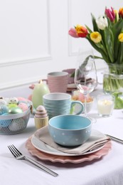 Photo of Festive table setting with beautiful flowers. Easter celebration