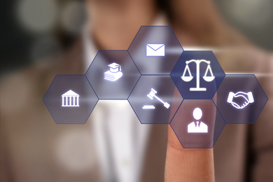 Image of Lawyer touching virtual screen with different icons, closeup 