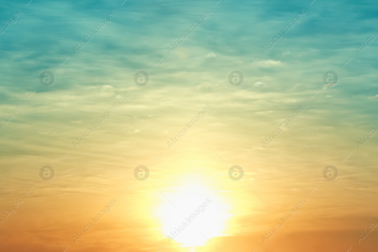 Photo of Picturesque view of beautiful sky lit by setting sun