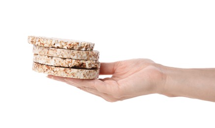 Photo of Woman holding stack of crunchy crispbreads on white background, closeup