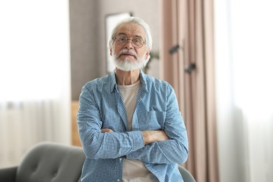 Photo of Portrait of happy grandpa with glasses indoors