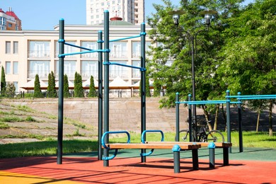 Photo of Empty outdoor gym with exercise equipment in park