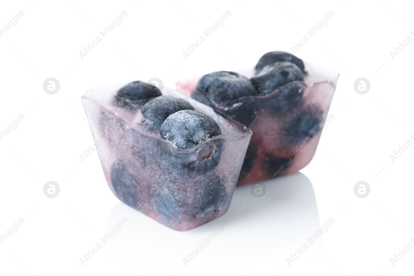 Photo of Ice cubes with blueberries on white background