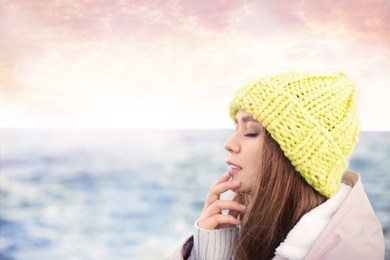 Photo of Portrait of beautiful young woman near sea