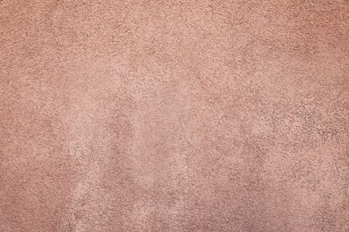 Photo of Texture of pink plaster wall as background
