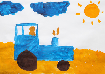 Photo of Child's painting of tractor in field on white paper