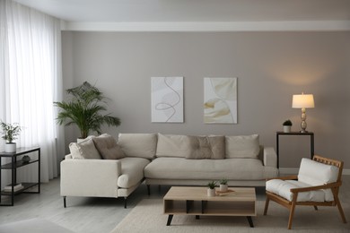 Photo of Big comfortable sofa in living room. Interior design