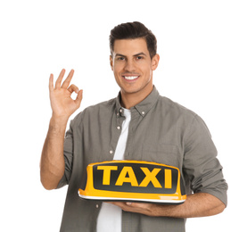 Photo of Man holding taxi sign on white background
