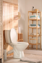 Photo of Modern toilet bowl in stylish bathroom interior