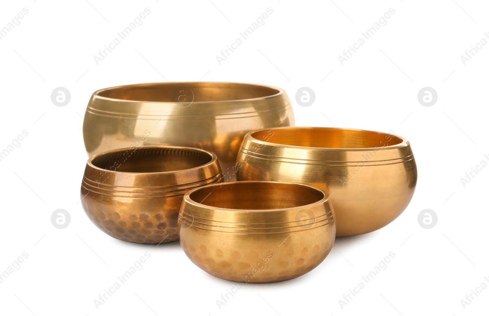 Photo of Four Tibetan singing bowls on white background