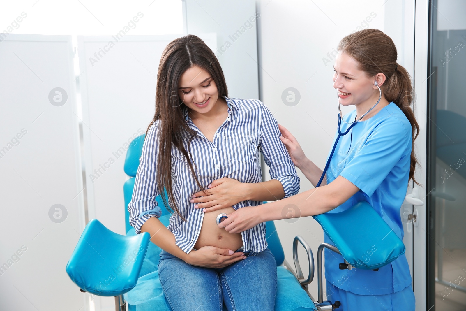 Photo of Pregnant woman having appointment at gynecologist office