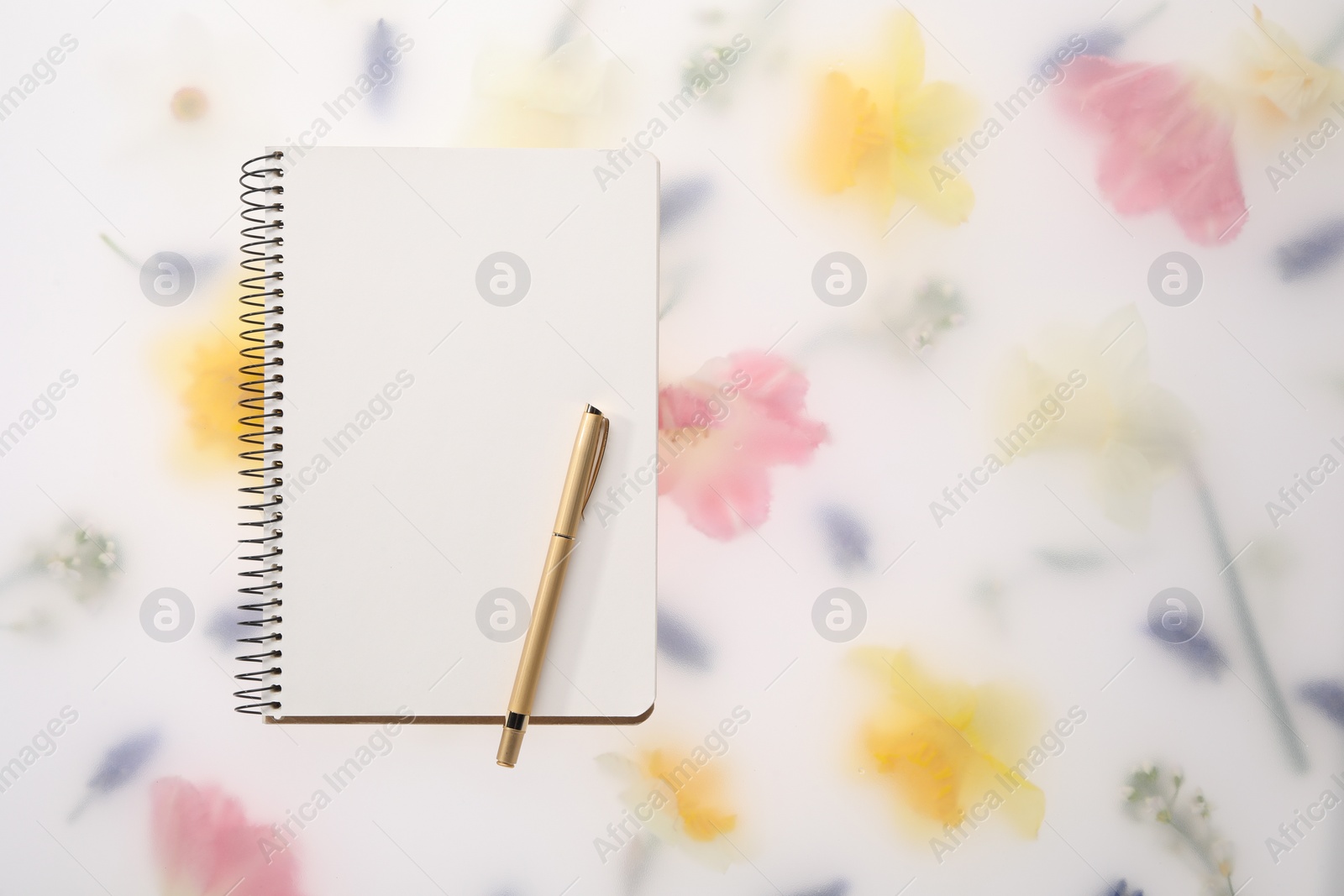 Photo of Guest list. Notebook and pen on spring floral background, flat lay. Space for text