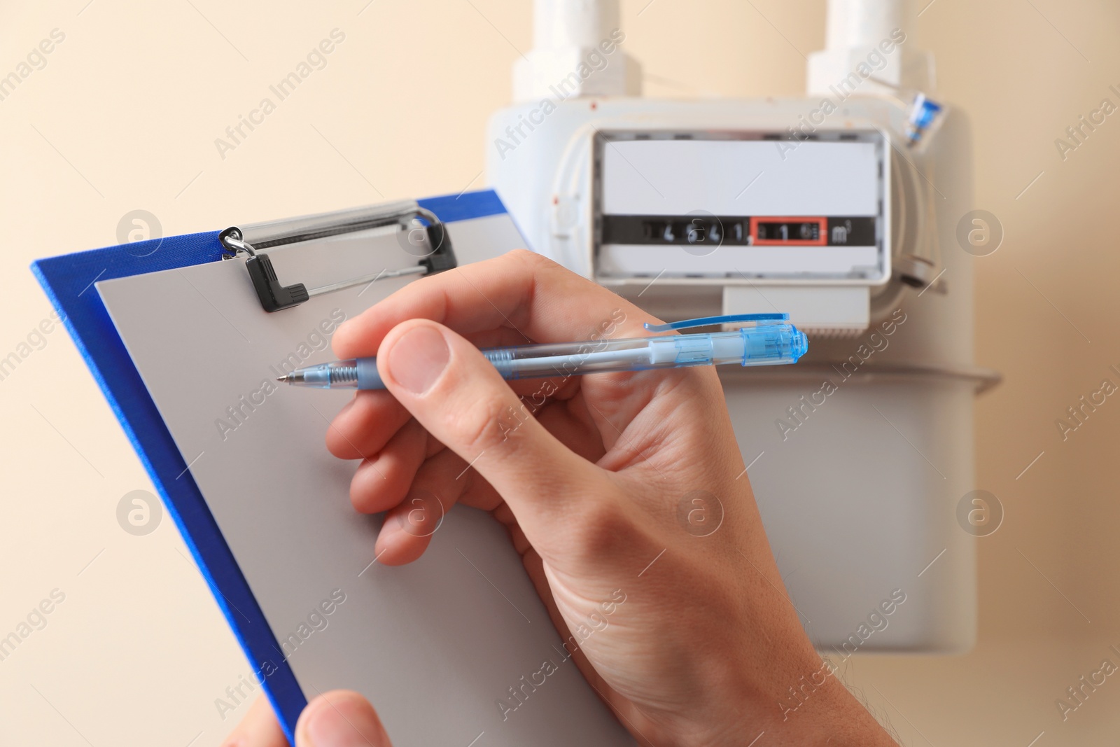 Photo of Man filling in gas receipt near counter, closeup