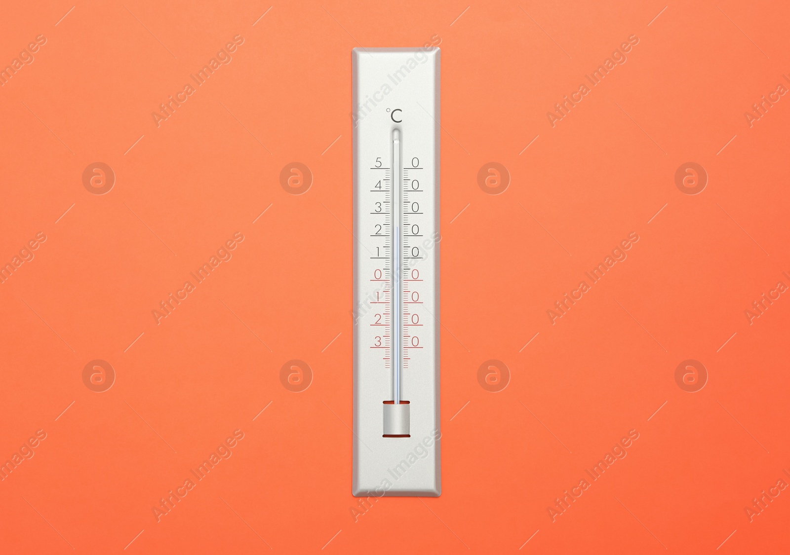 Photo of Weather thermometer on orange background, top view