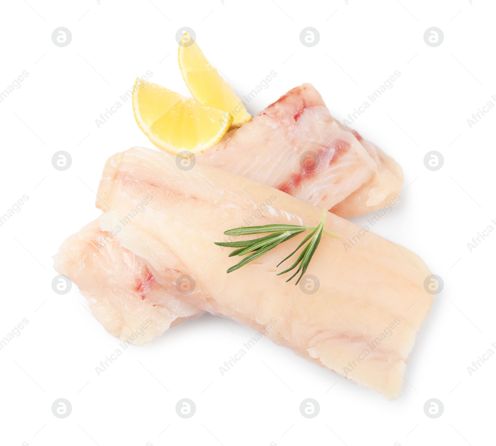 Photo of Pieces of raw cod fish, rosemary and lemon isolated on white