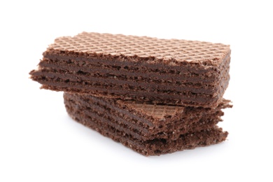 Photo of Delicious broken crispy wafer on white background. Sweet food