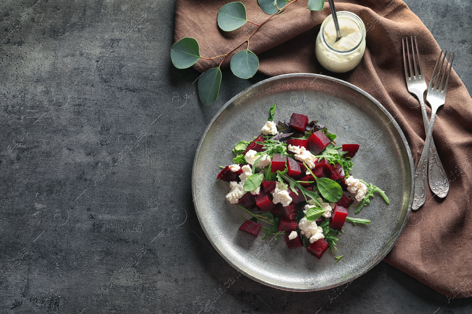 Photo of Plate with delicious beet salad served on table, top view