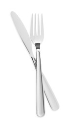 Photo of Fork and knife isolated on white, top view. Stylish shiny cutlery set