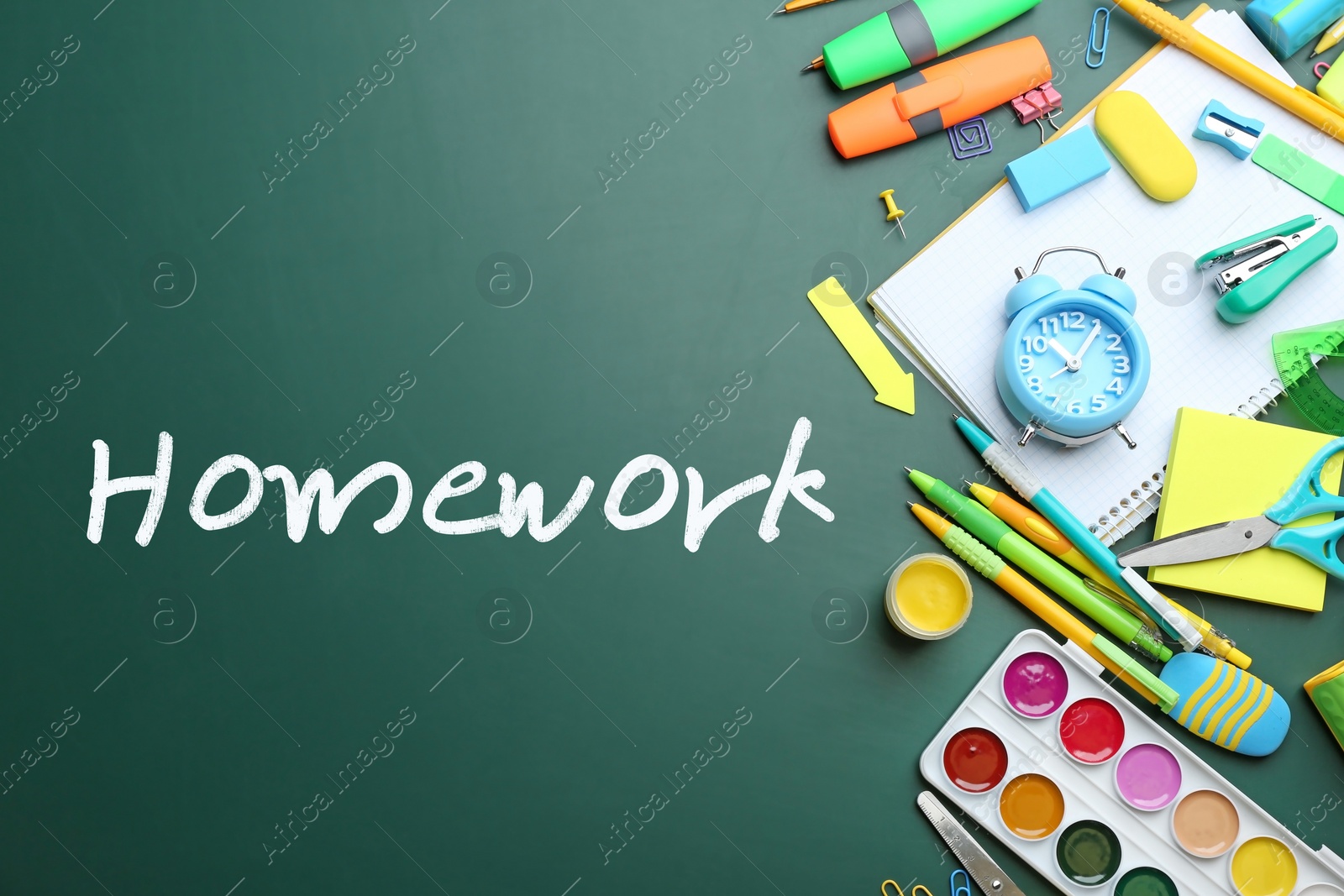 Image of Flat lay composition with school supplies and inscription HOMEWORK on chalkboard