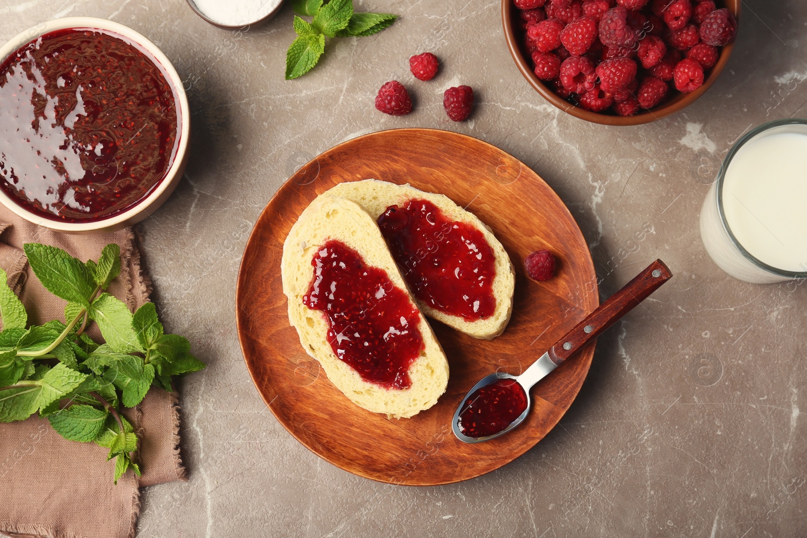 Photo of Beautiful composition with delicious raspberry jam on table, top view