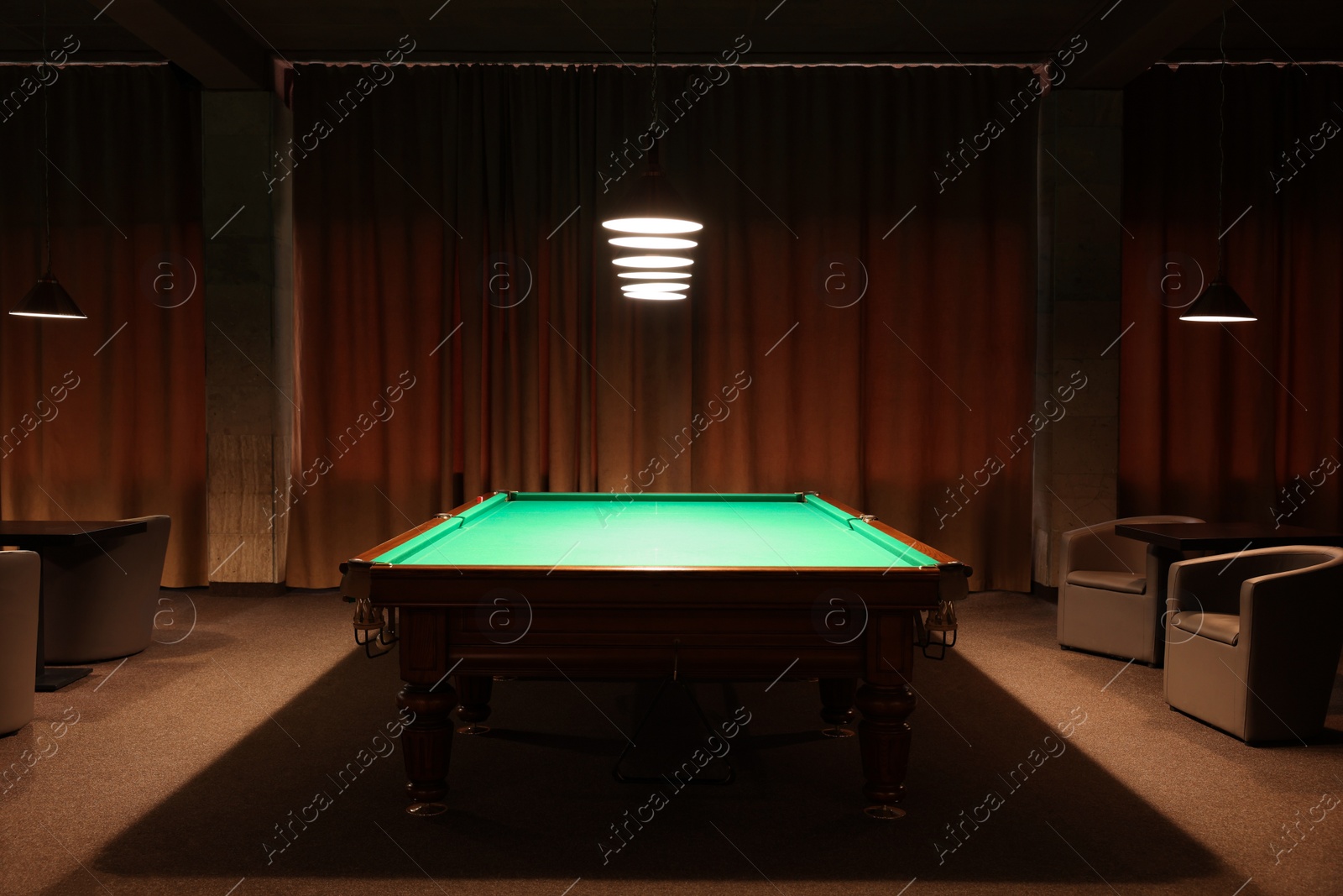 Photo of Empty green billiard table in club. Pool Game