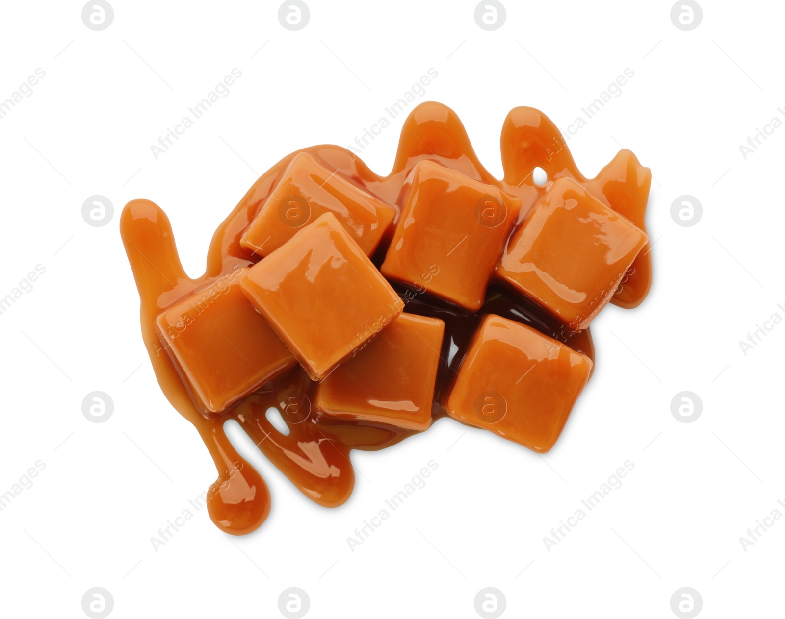 Photo of Caramel candies with topping on white background, top view