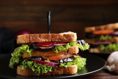 Photo of Delicious fresh eggplant sandwich on plate, closeup