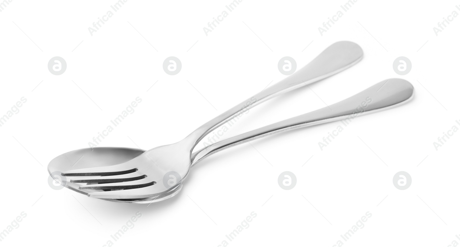 Photo of Clean shiny fork and spoon isolated on white. Cooking utensils