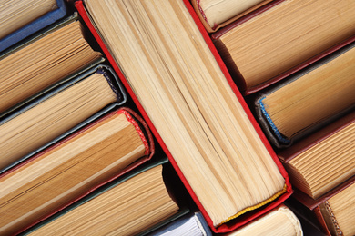 Photo of Many different hardcover books as background, top view