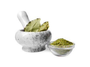 Photo of Mortar and pestle with bay leaves on white background