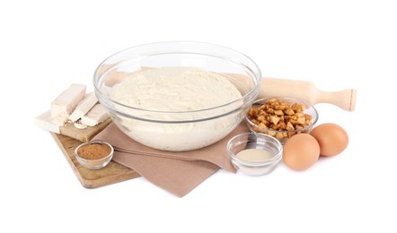 Photo of Fresh yeast dough and ingredients for cake on white background