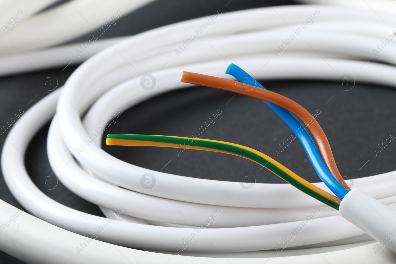 Photo of One new electrical wire on gray background