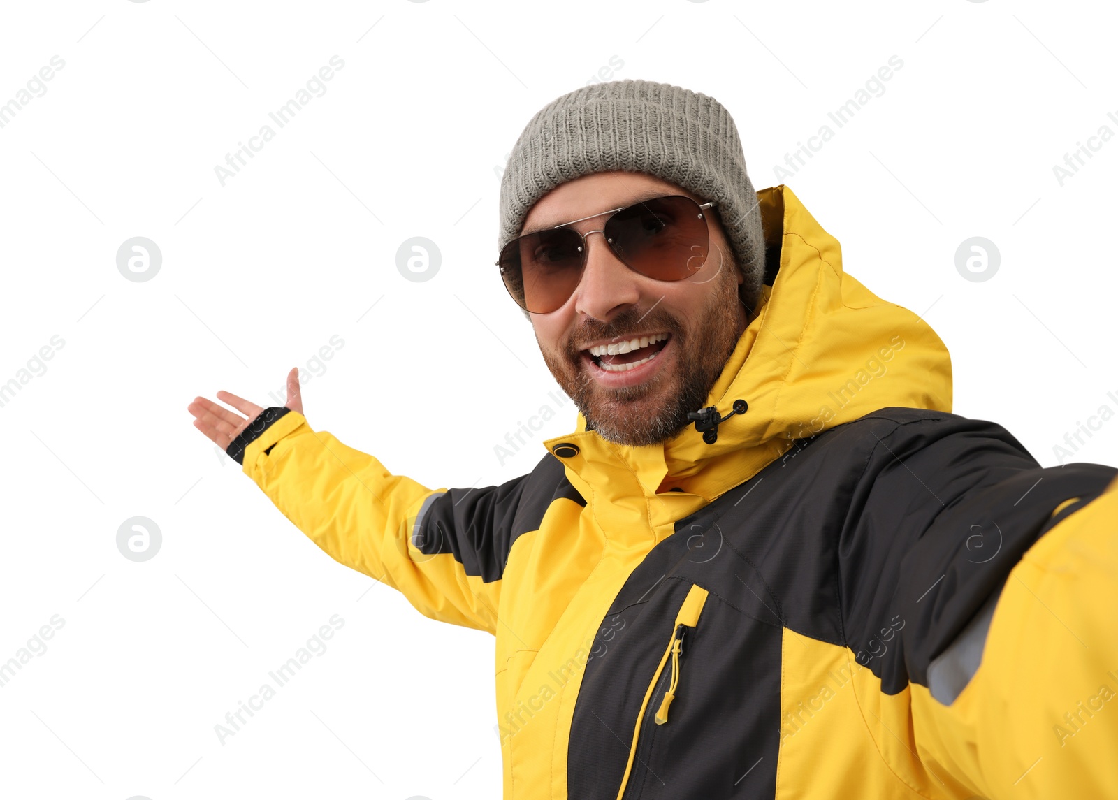 Photo of Smiling man in hat and sunglasses taking selfie on white background