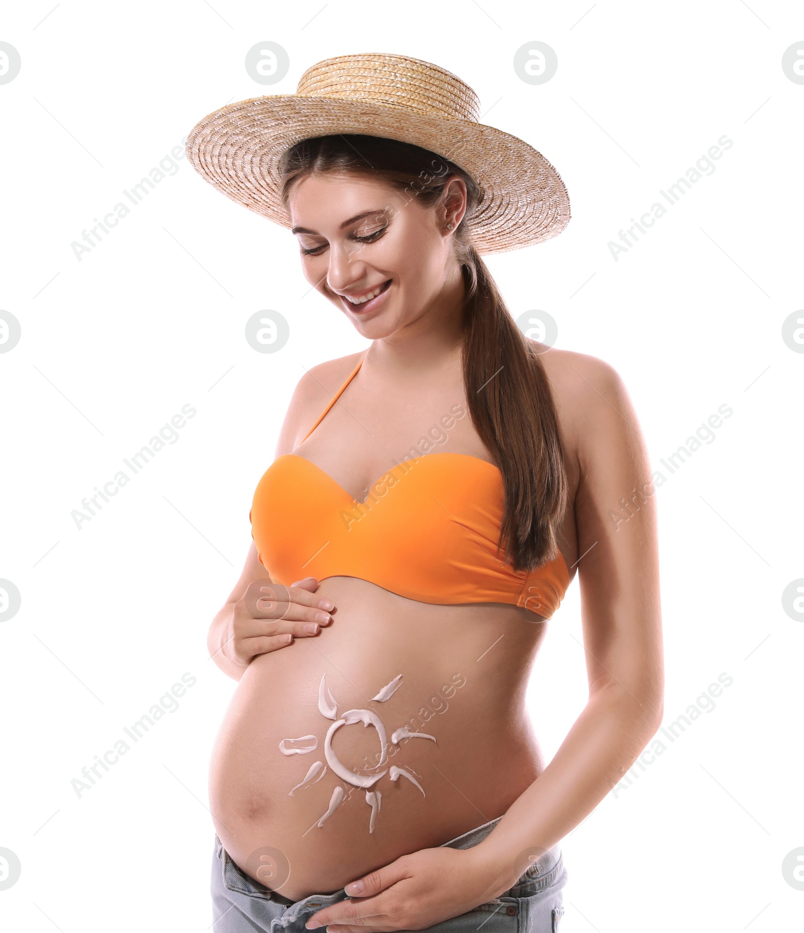 Photo of Young pregnant woman with sun protection cream on belly against white background