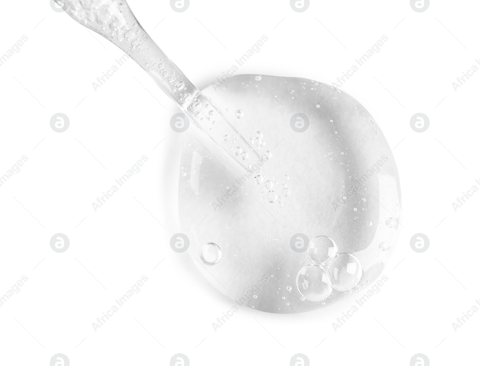 Photo of Glass pipette and transparent liquid isolated on white, top view