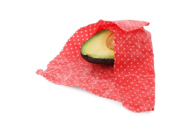 Photo of Half of avocado in beeswax food wrap isolated on white