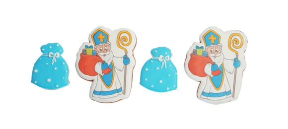 Tasty gingerbread cookies on white background, top view. St. Nicholas Day celebration